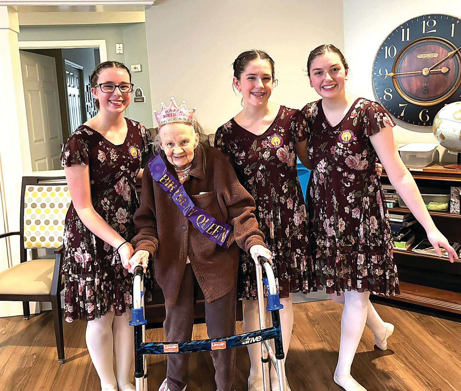 Frances Mollyn shares a smile with ballet dancers on her 100th birthday. Dancers are, from left, Bethany Davis, Julia Worner, and Adleigh Strickland.