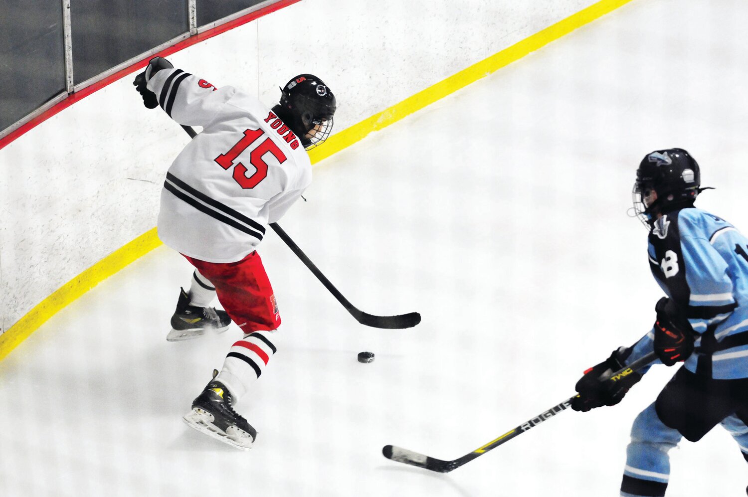 Jaden Young, left, controls the puck for CB East in Feb. 2 duel with North Penn.