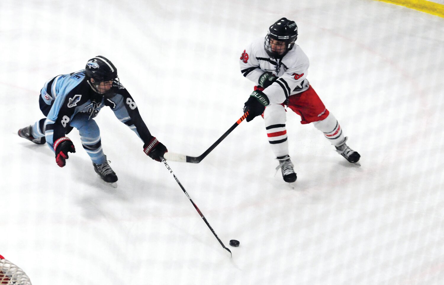 Corey Kosick, right, controls the puck for CB East in Feb. 2 duel with North Penn. James Boyle defends for the Knights.