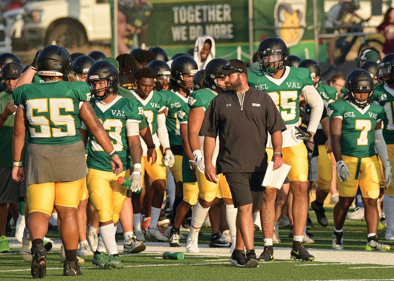 Mike Isgro leads the DelVal football team on the field as an assistant coach during the 2023 season.