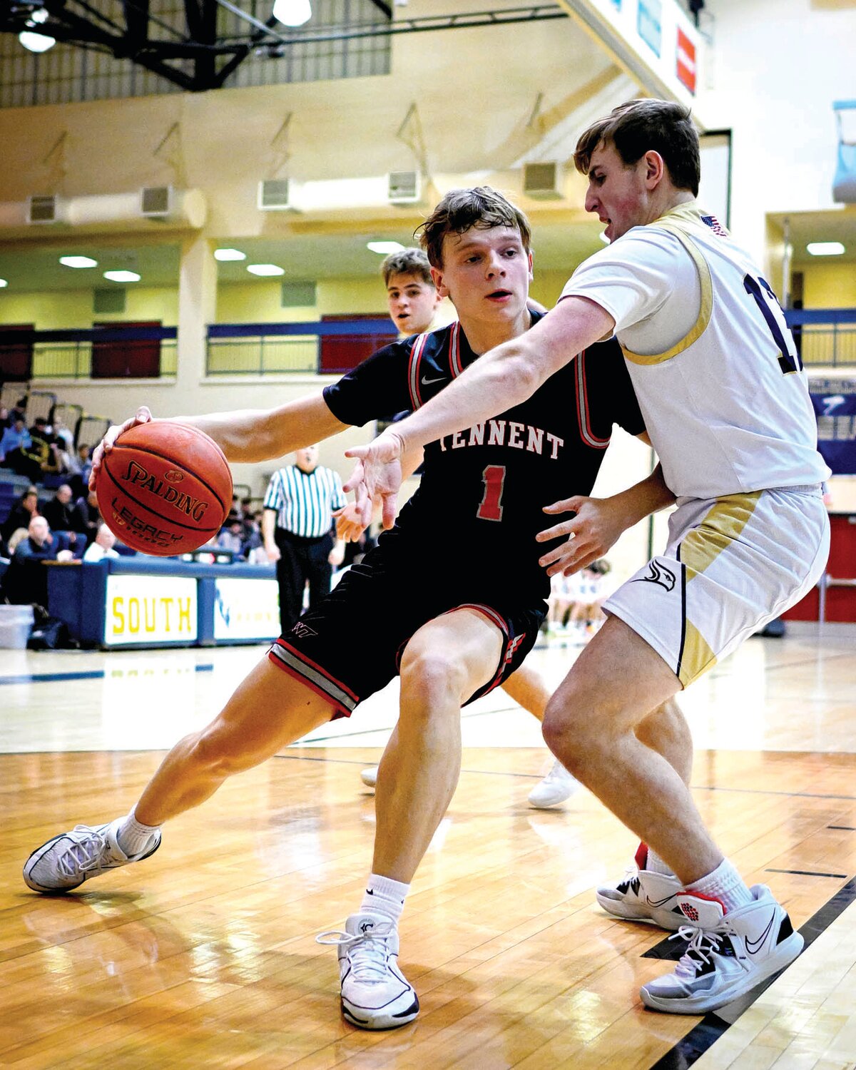 William Tennent’s Kirby Mooney makes his way to the basket around Council Rock South’s Spencer Kredo.