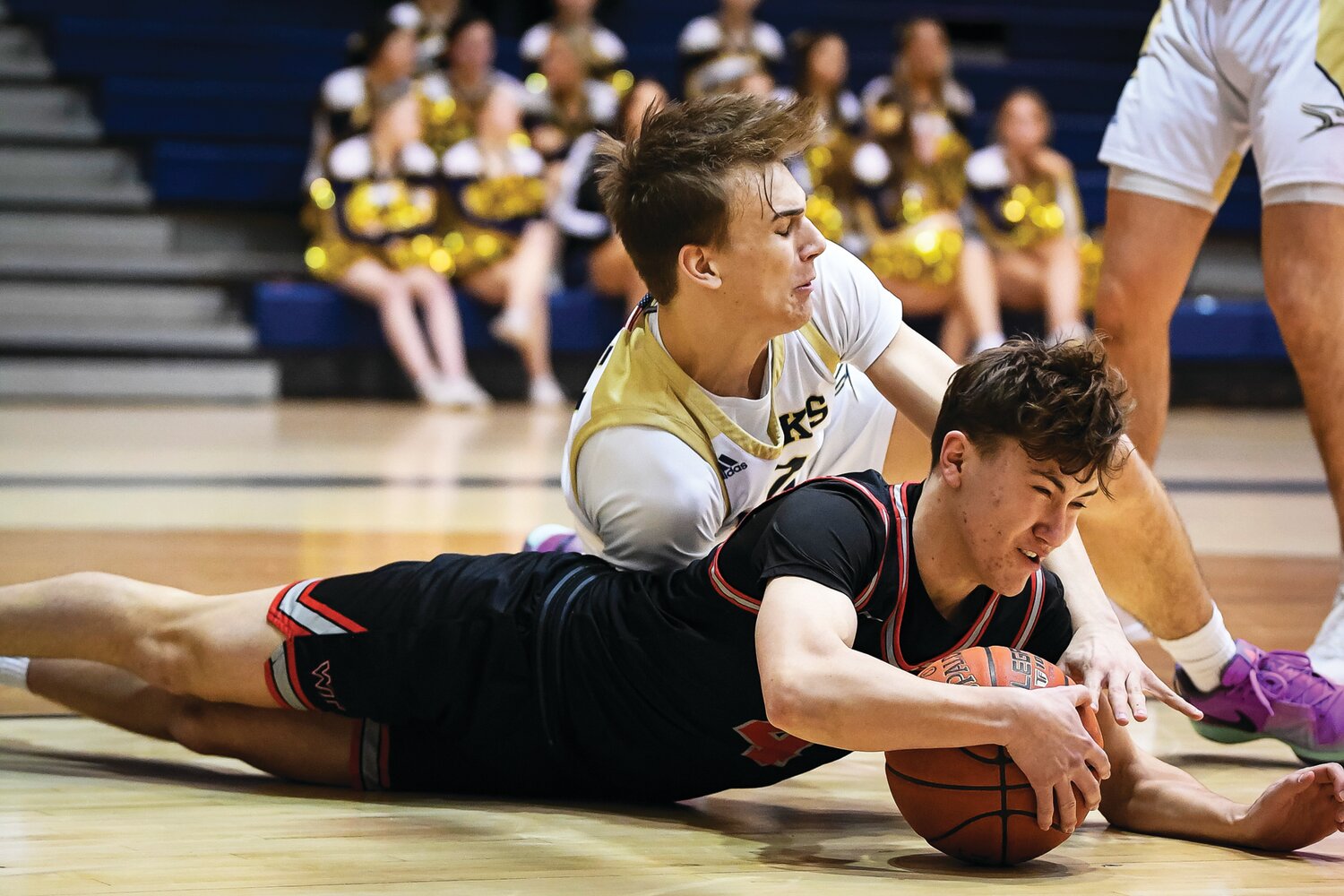 William Tennent’s Luke Torok dives for a loose ball in front of Council Rock South’s Gabe Cerulli during the first quarter.