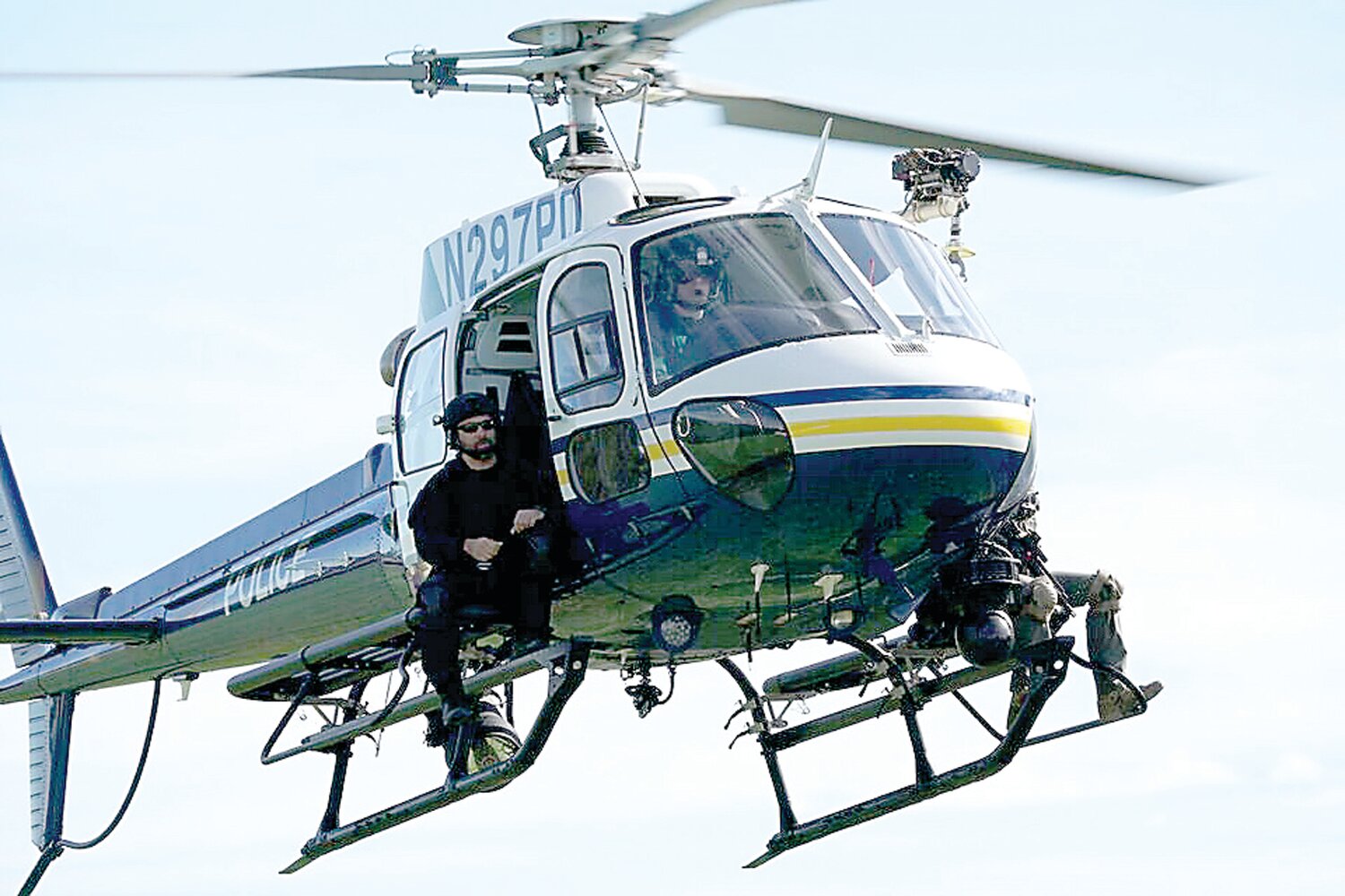 Falls Township Sgt. Raymond Fanelli is shown cross training with Philadelphia Police Tac Air.