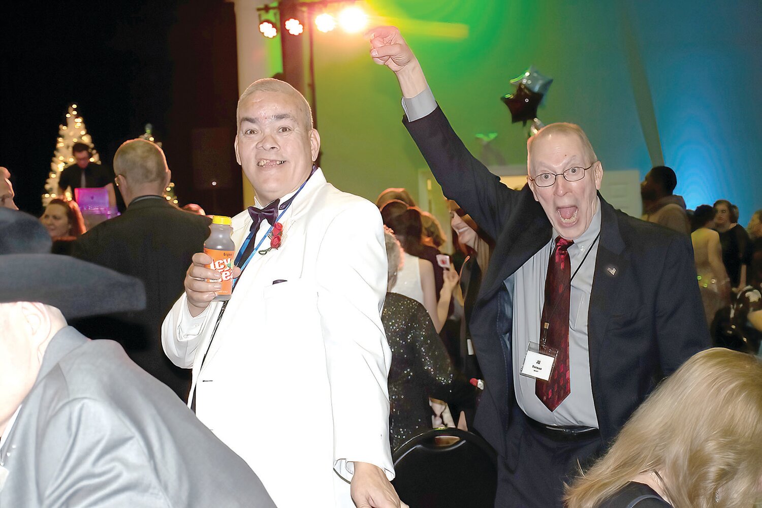 Carlos Stoltz and his Night to Shine buddy Al Herman show off their moves on the packed dance floor.
