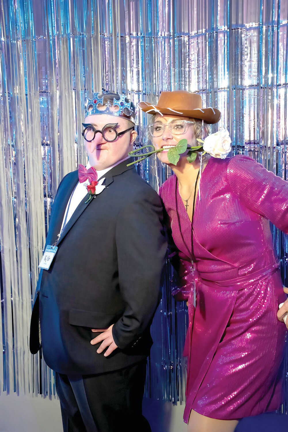 Kyle Strassburg and his Night to Shine buddy Stacy Pletz have fun at the photo booth.