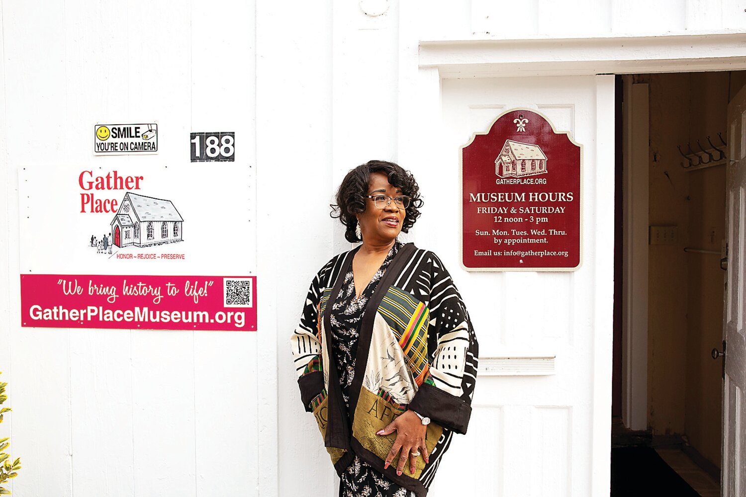 Shirley Lee Corsey, executive director and legal conservator of Gather Place Museum, stands just outside the main entrance of the site.