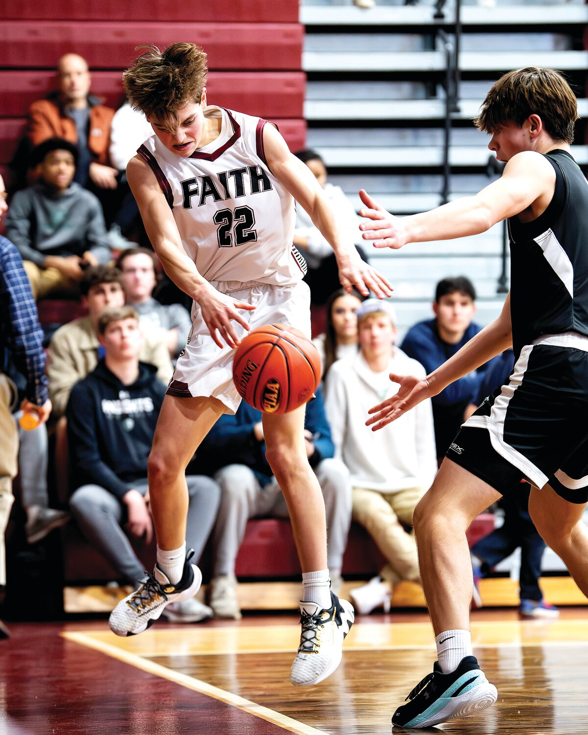 Faith Christian’s Jagger Verbit tries to spike the ball against Delco Christian’s Caleb Jameson in the second half.