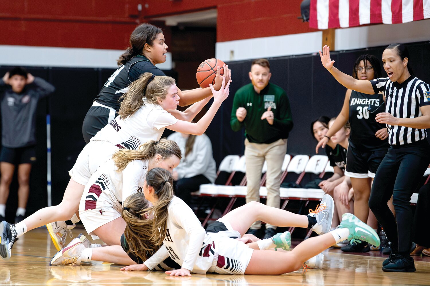Faith Christian’s Brigid Garlick tries to secure a loose ball with seconds left in the game and Faith down by two points.