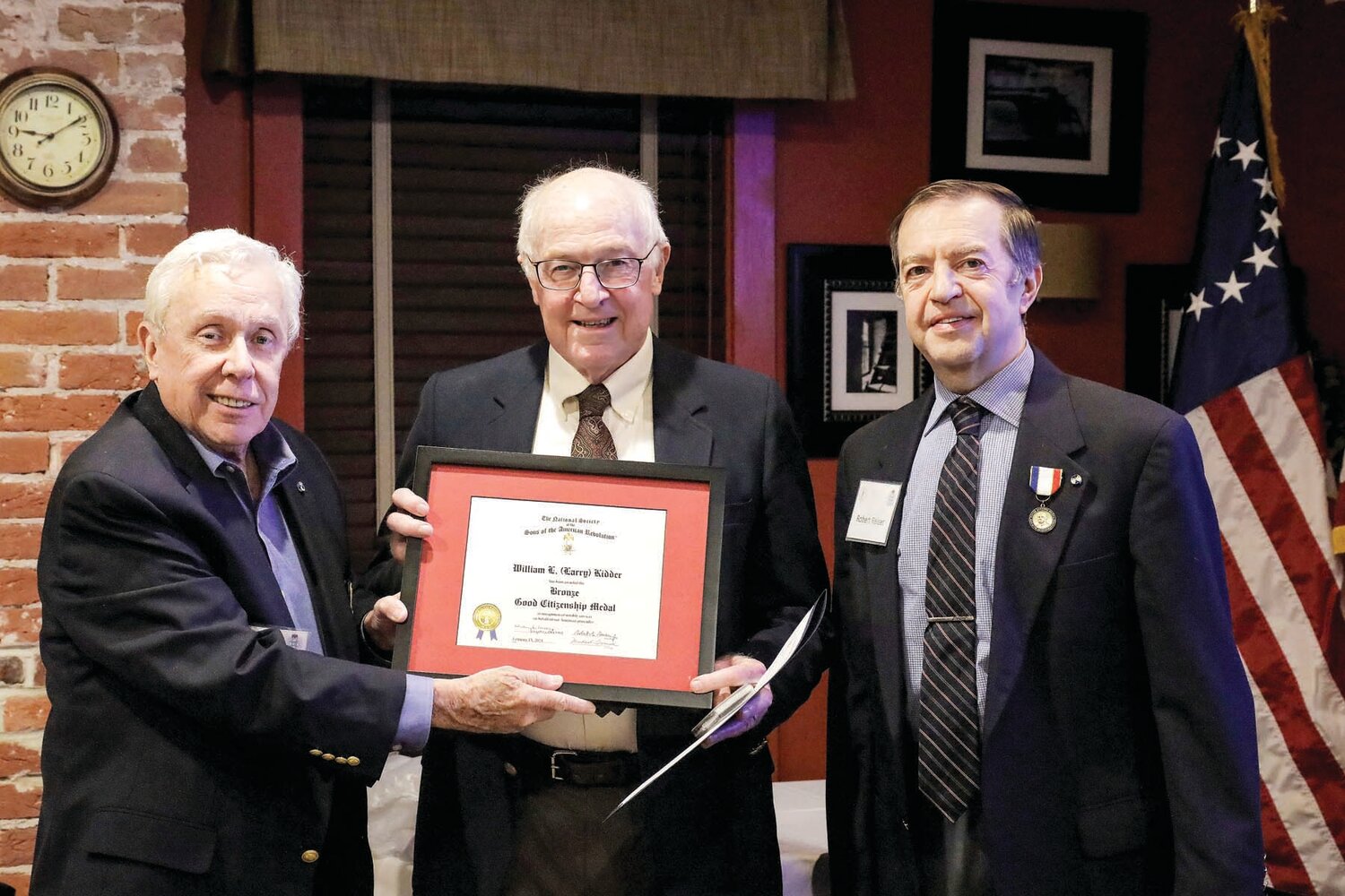Chapter President Bob Reiser and Vice President Steve Ware present Larry Kidder with the Bronze Good Citizenship Medal and Certificate.