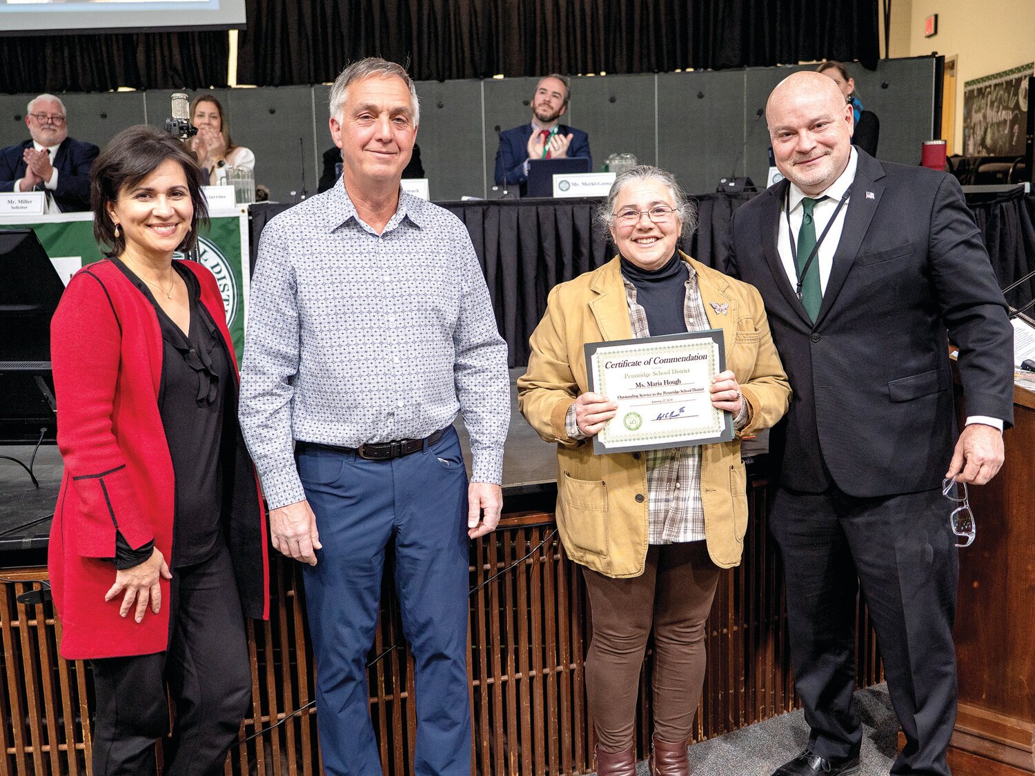 Maria Hough holds her Certificate of Commendation for Outstanding Service to Pennridge School District. With her at the award presentation are, from left, School Board Vice President Christine Batycki, School Board President Ron Wurz, and School Superintendent Angelo Berrios.