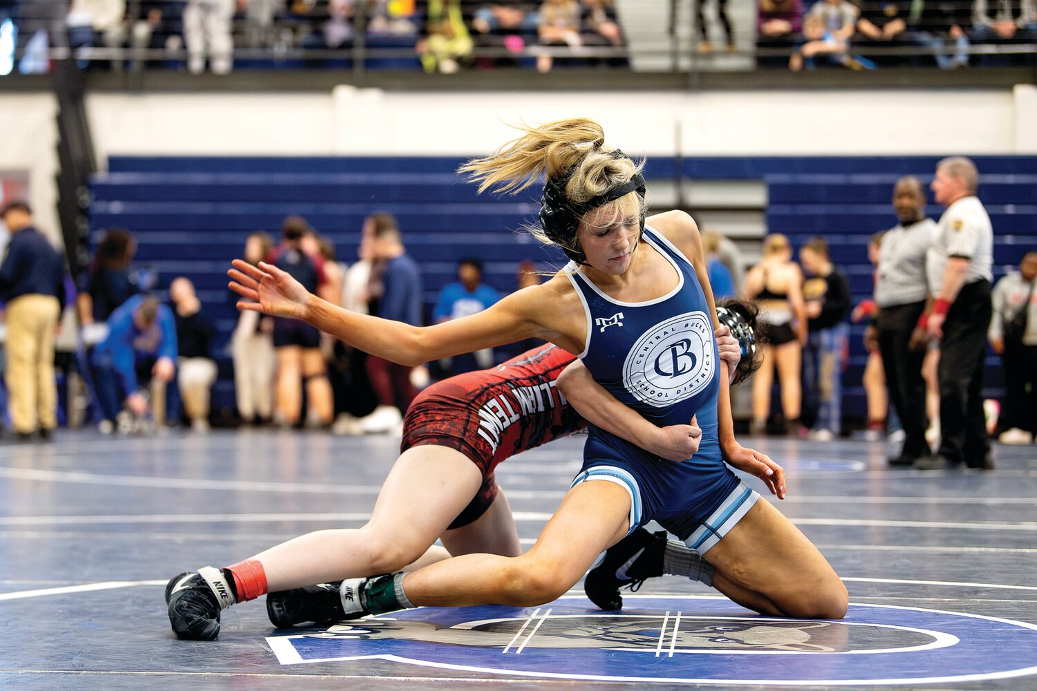 Central Bucks’ Macayla Needham gets taken down by William Tennent’s Anjaleen Siddiqui during a 112-pound fourth-place match.