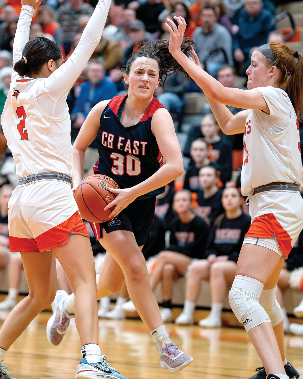 Central Bucks East’s Anna Barry gets fouled while driving through the double team of Perkiomen Valley’s Bella Bacani and Grace Galbavy. Barry would make the second of two free throws for her 1,000th career point.