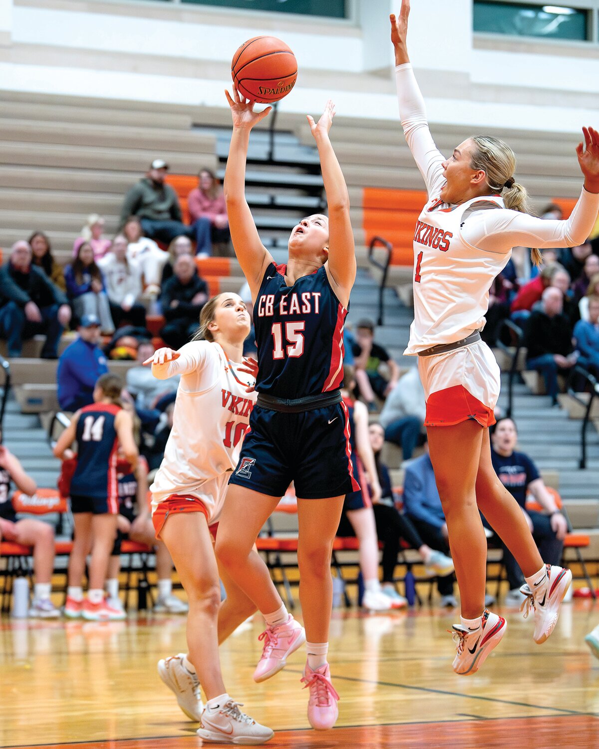 Central Bucks East’s Emma Penecale battles for a rebound against Perkiomen Valley’s Kate Nemic and Anna Stein.