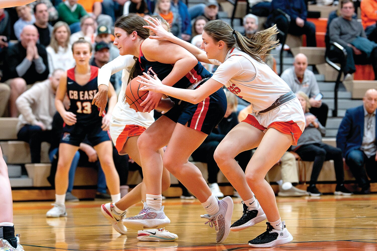 Central Bucks East’s Jess Lockwood gets fouled while driving the lane by Perkiomen Valley’s Julia Smith.