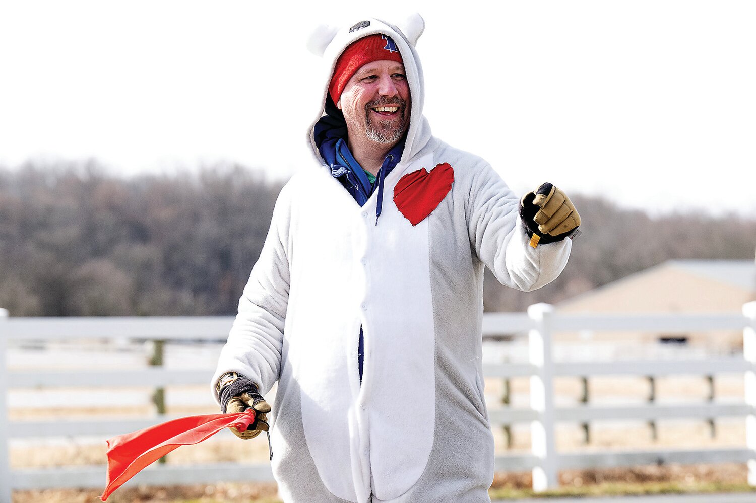 David Jacoby, dressed for the occasion, helps to direct the runners at Delaware Valley University during the Great Cupid Run, an event hosted by Scoogie Events.