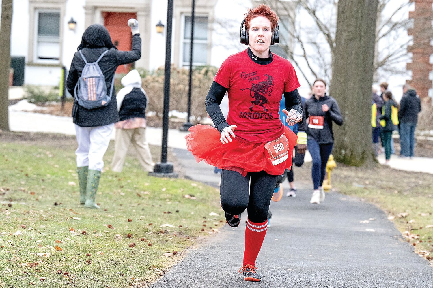 Erin McCardle, of Philadelphia, was one of many runner to sport their romantic best as they made their way through the race course at Delaware Valley University during the Great Cupid Run.
