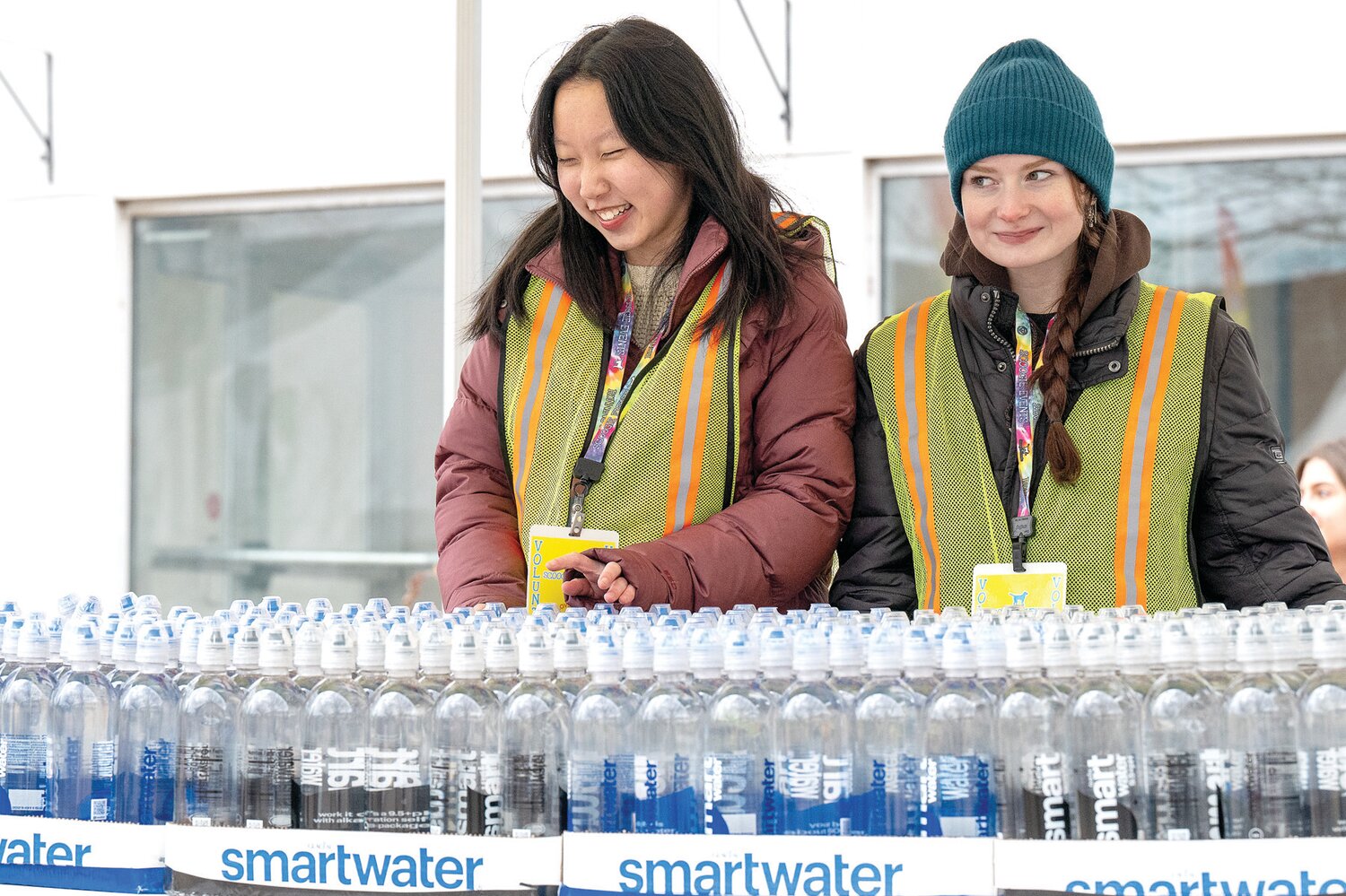 High school students from Central Bucks volunteer by handing out water to the racers following the Great Cupid Run, an event hosted by Scoogie Events.