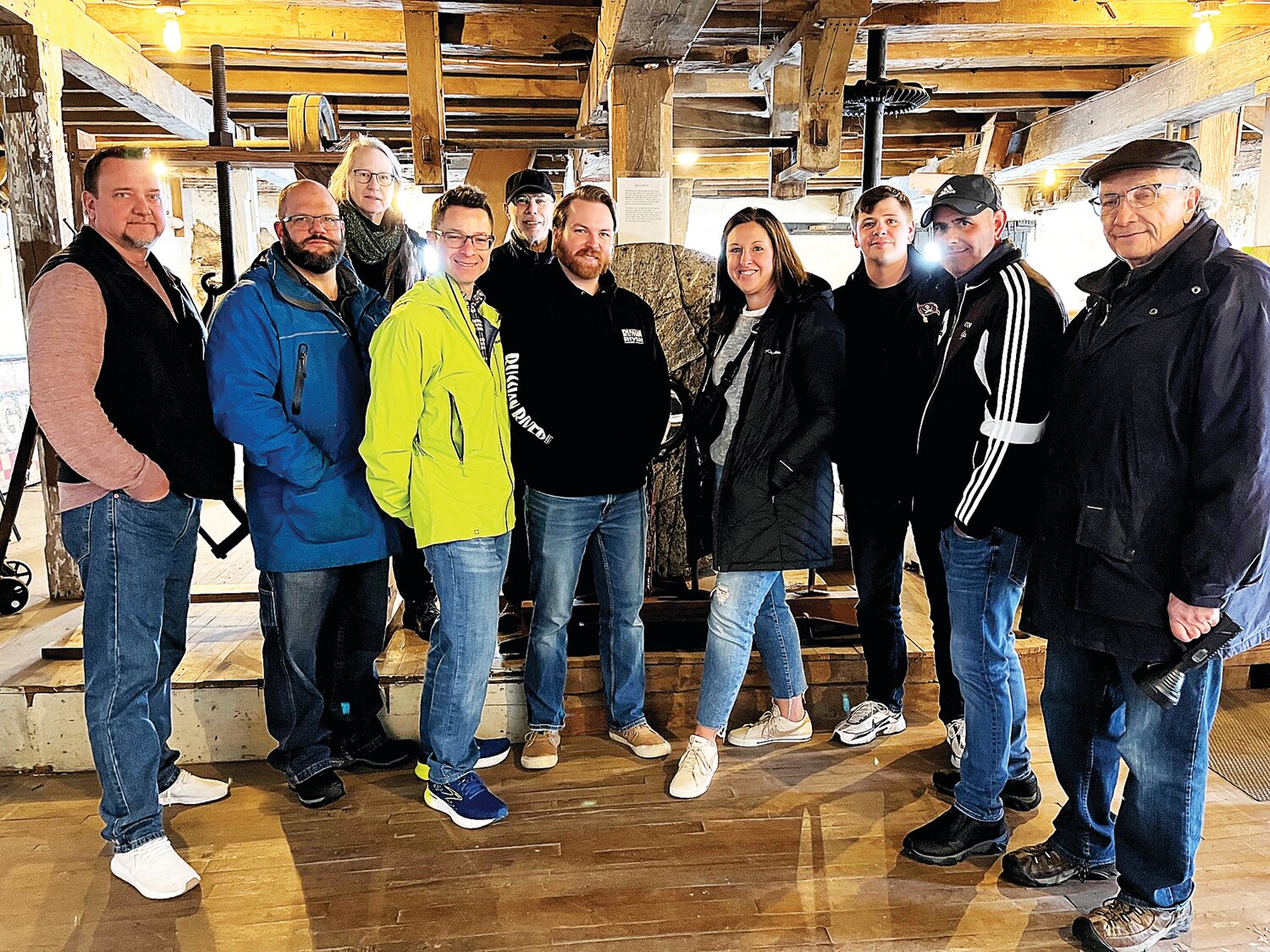 Palisades High School and Middle School social studies teachers pose with members of the Durham Historical Society during a tour of the Durham Grist Mill. The educators are incorporating more local history in the schools’ curriculum.