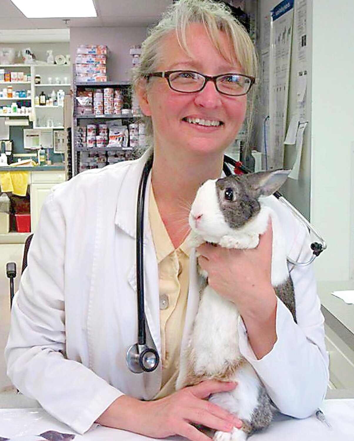 Dr. Christina Knight of the Animal Hospital of Warwick holds a furry friend.