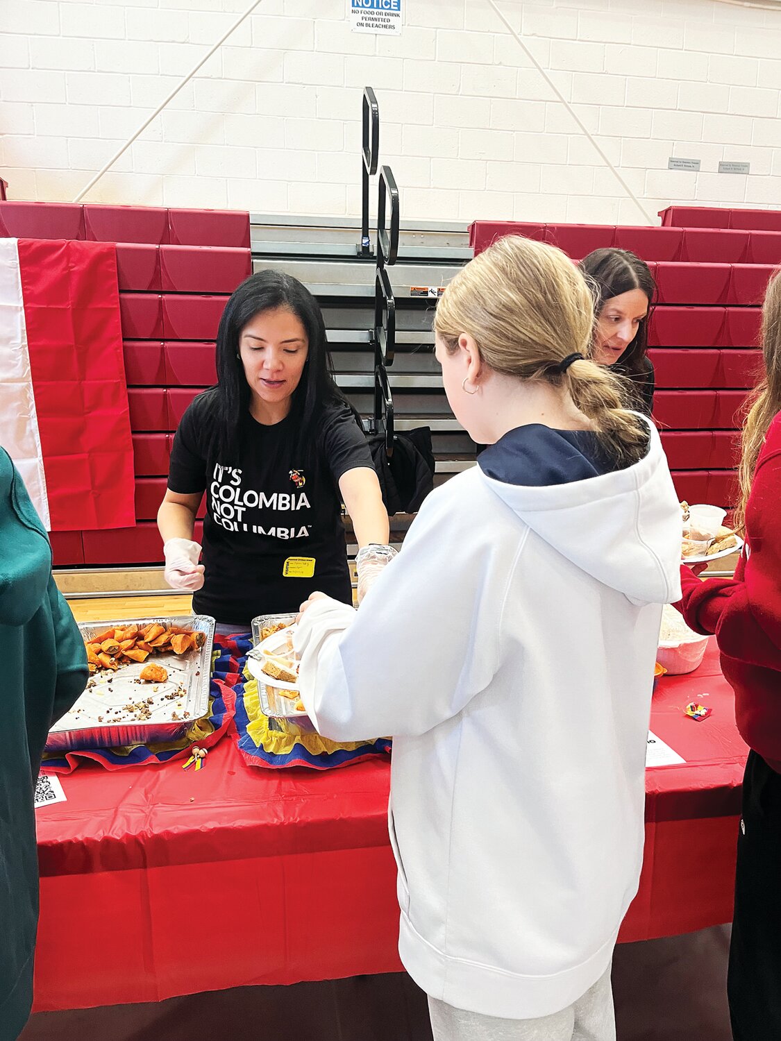 A student samples a Colombian dish at the recent Plumstead Christian School International Festival.