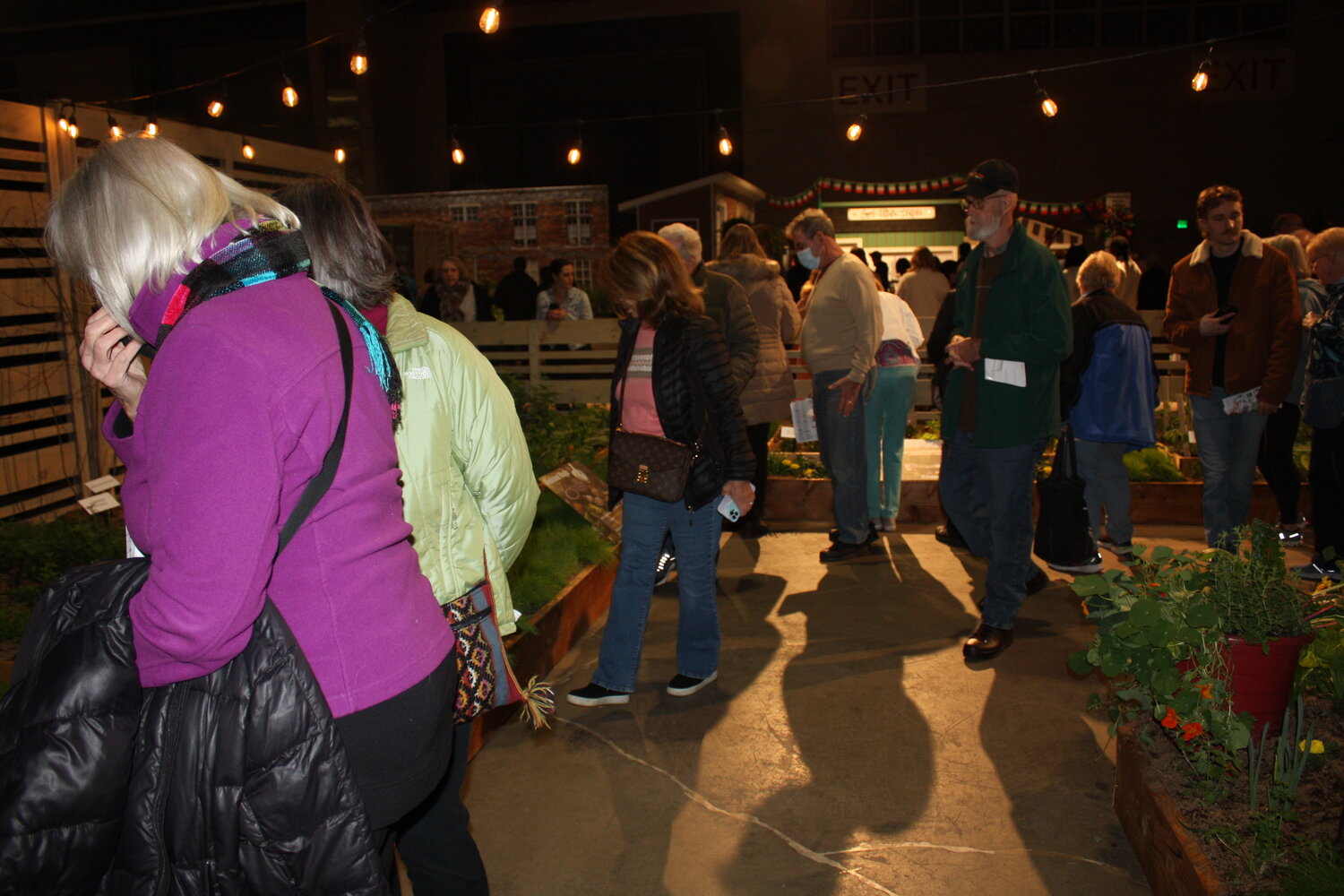 Flower Show guests check out plant beds created by Delaware Valley University for its exhibit, “Lettuce Turnip the Beet: The Gritty Value of Plants.”