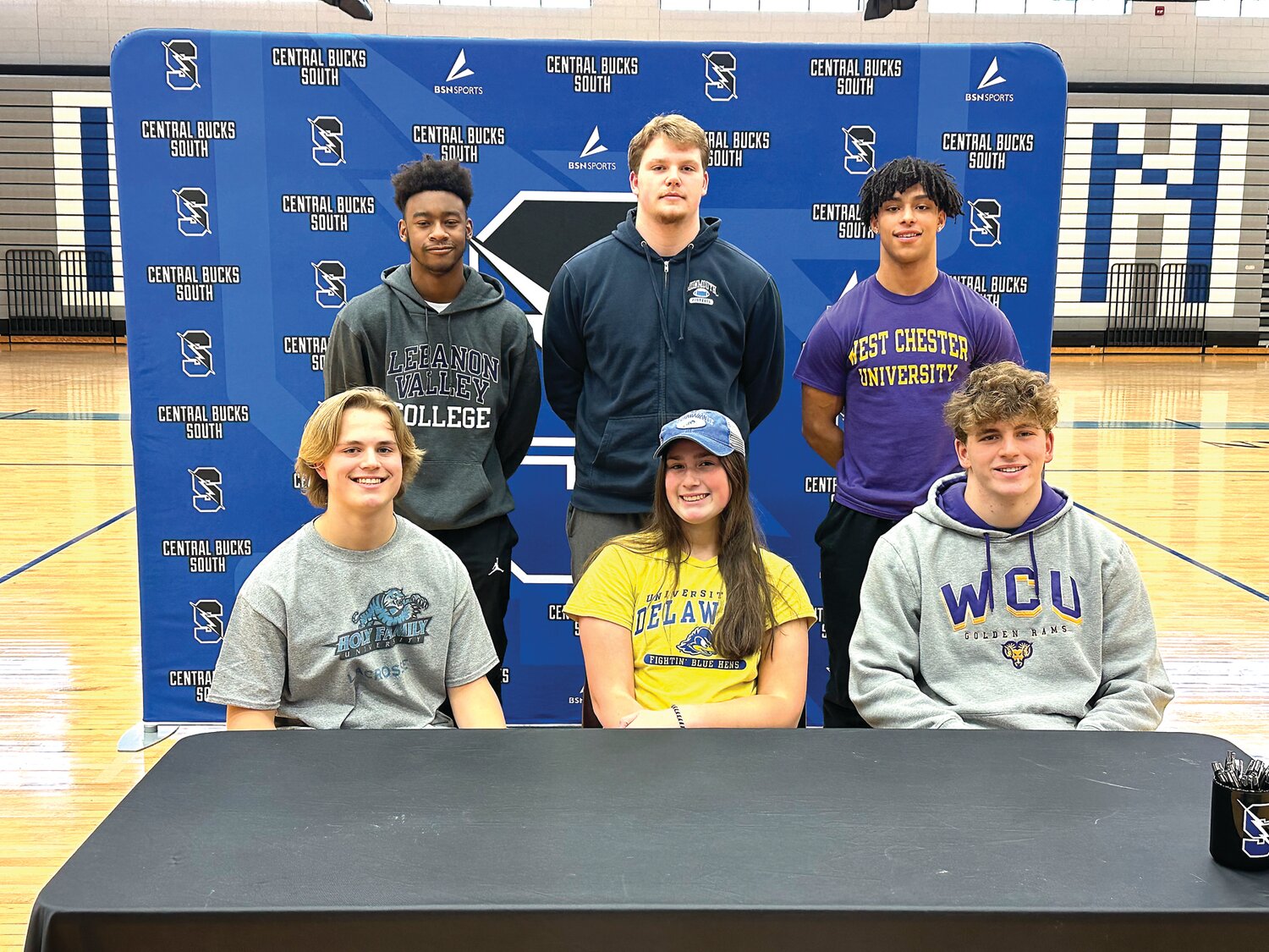 Central Bucks South recently honored six seniors for their commitment to compete in collegiate sports. From left are: front row, John Henson, Rosie Marraccini, Sean Moskowitz; back row, Corey Moore, Collin Goetter and Anthony Leonardi.