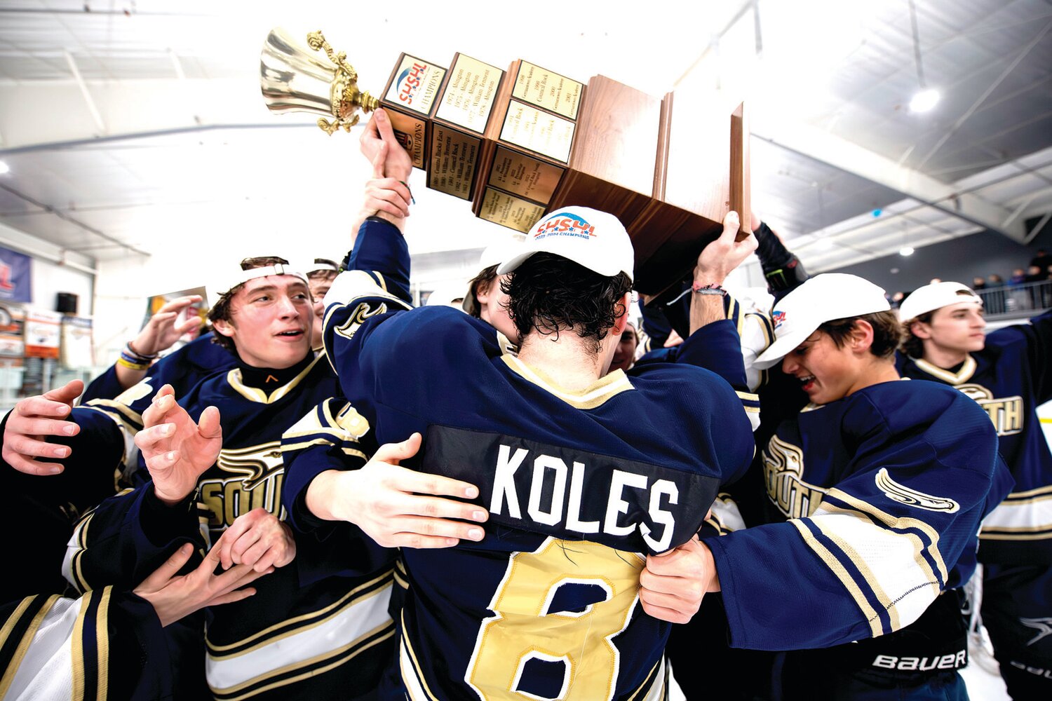 Council Rock South captain Kevin Koles joins the team after being presented the Suburban High School Hockey League championship trophy.