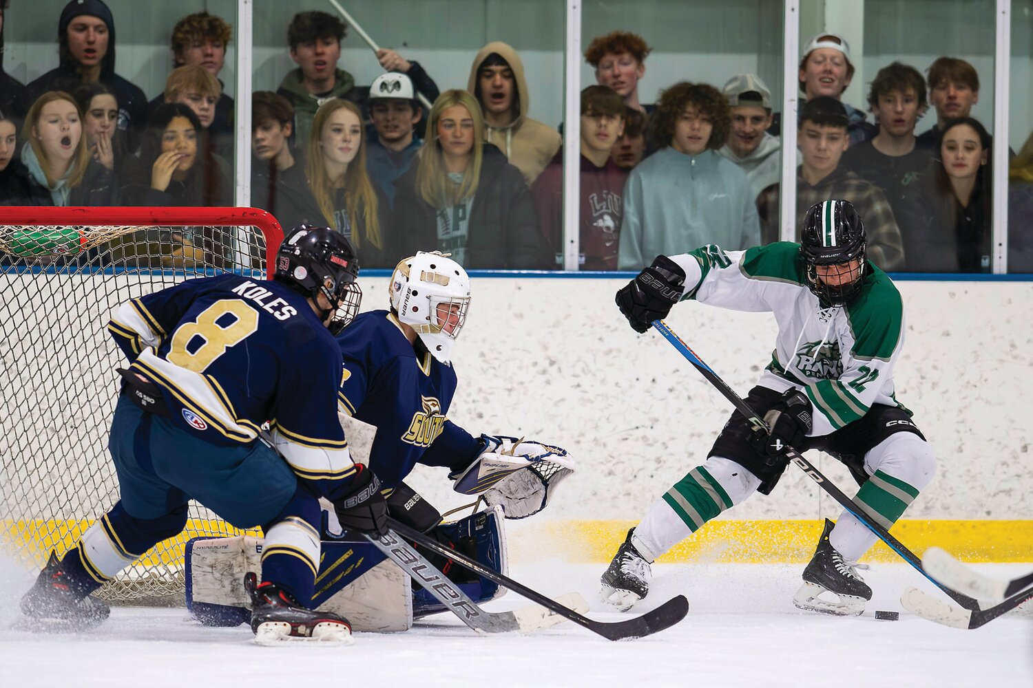 Pennridge’s Shane Dachowski gets stopped while trying to get a shot off in front of Council Rock South’s Kevin Koles and goalie Trevor Rakszawski during the Suburban High School Hockey League final.