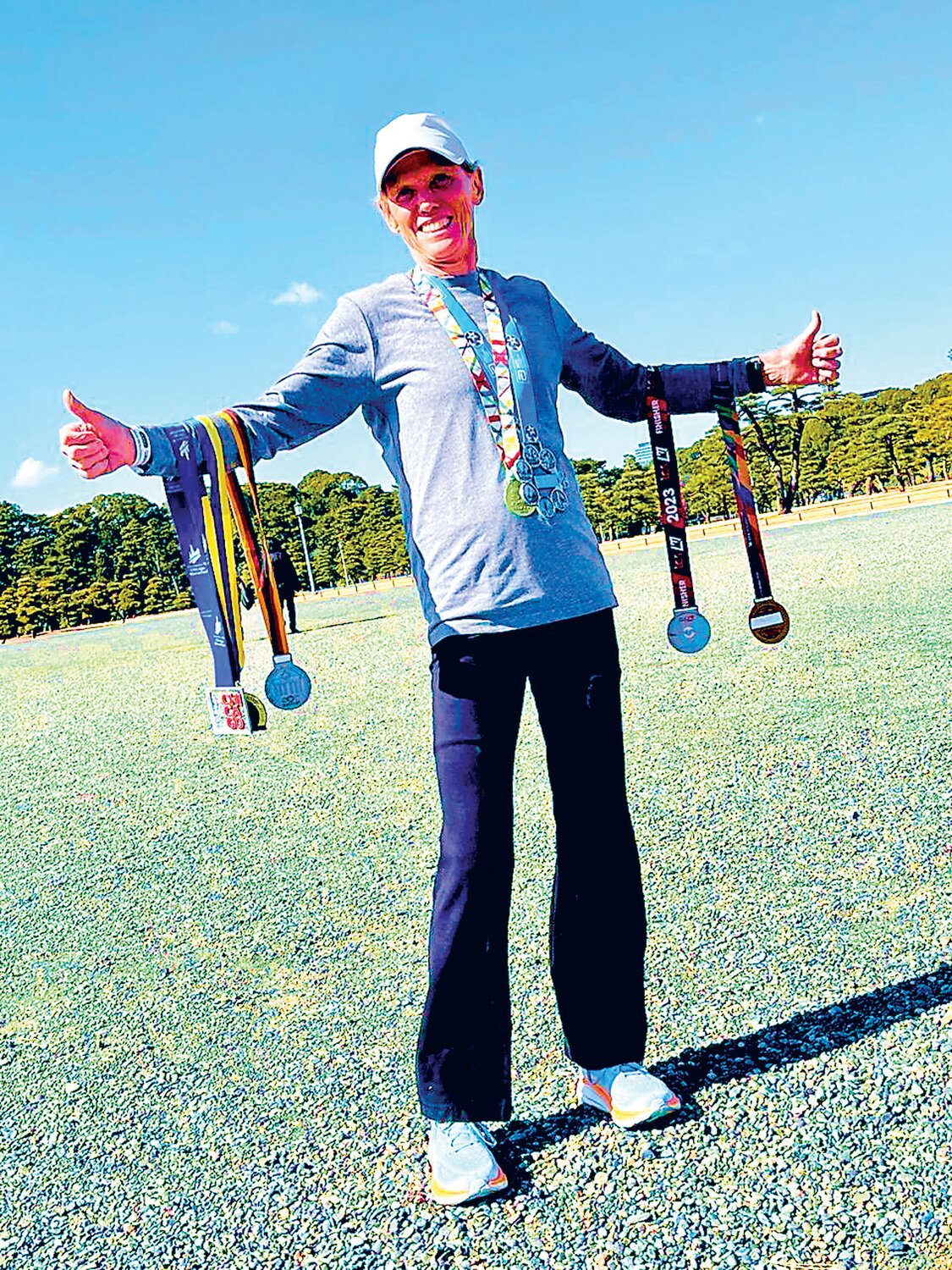 New Britain’s Nancy Smith displays her six world major medals after completing the Tokyo Marathon on March 3.