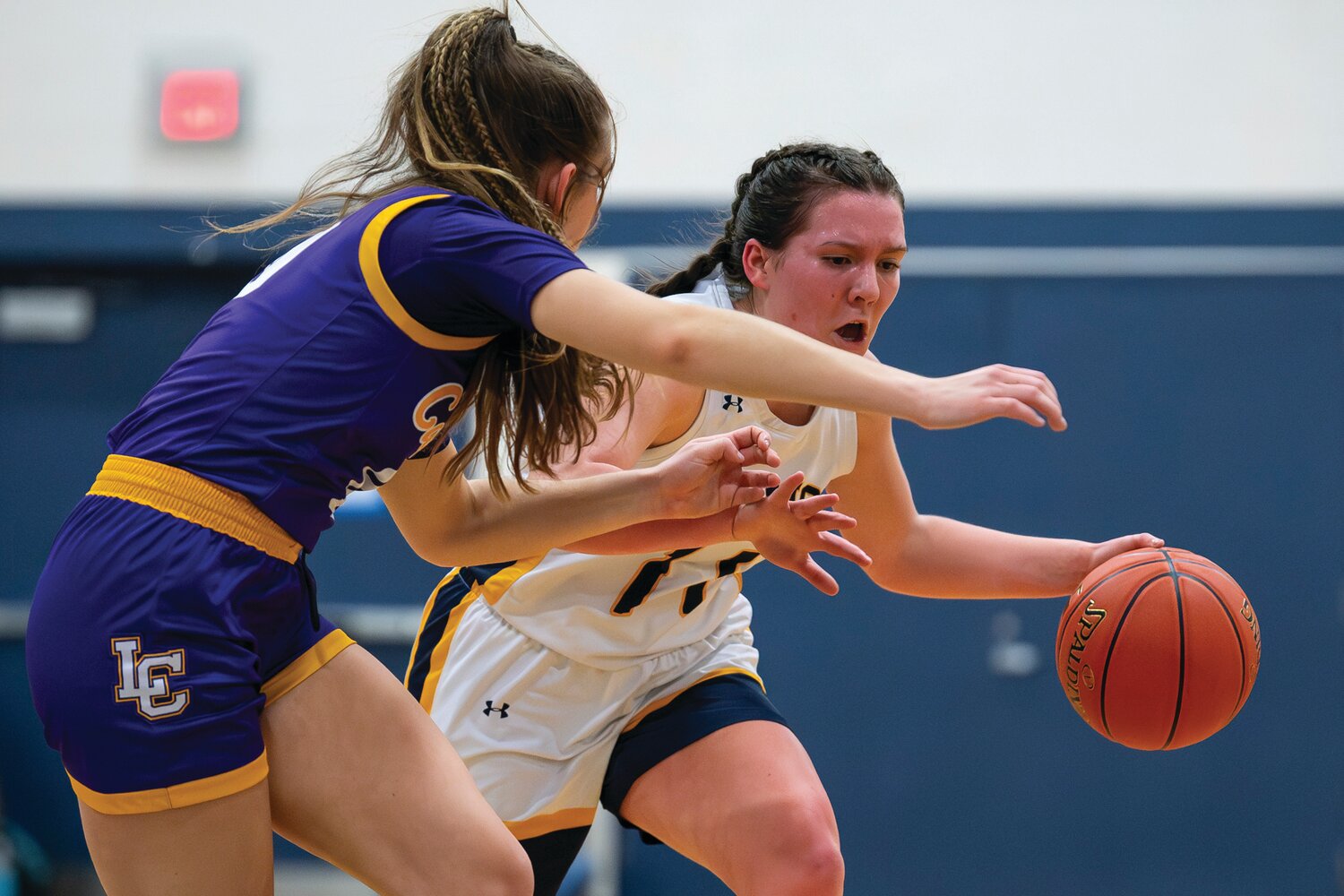 New Hope-Solebury’s Emily Wilson tries to get around the press defense of Lancaster Catholic’s Lily Lehman in the first quarter.
