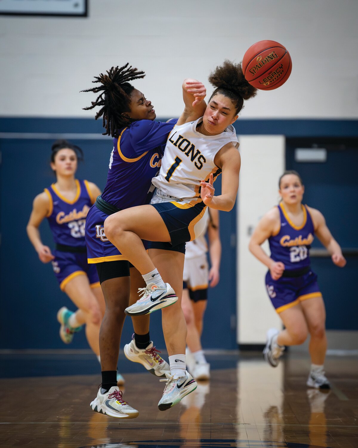 New Hope-Solebury’s Nina Meixler gets off a pass as Lancaster Catholic’s Carleigh Anderson crashes into her during Tuesday’s PIAA second-round game.