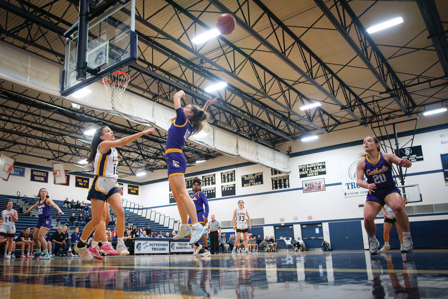 New Hope-Solebury Isabella Elizondo gets off a pass over the leaping Lily Lehman of Lancaster Catholic in the second quarter.