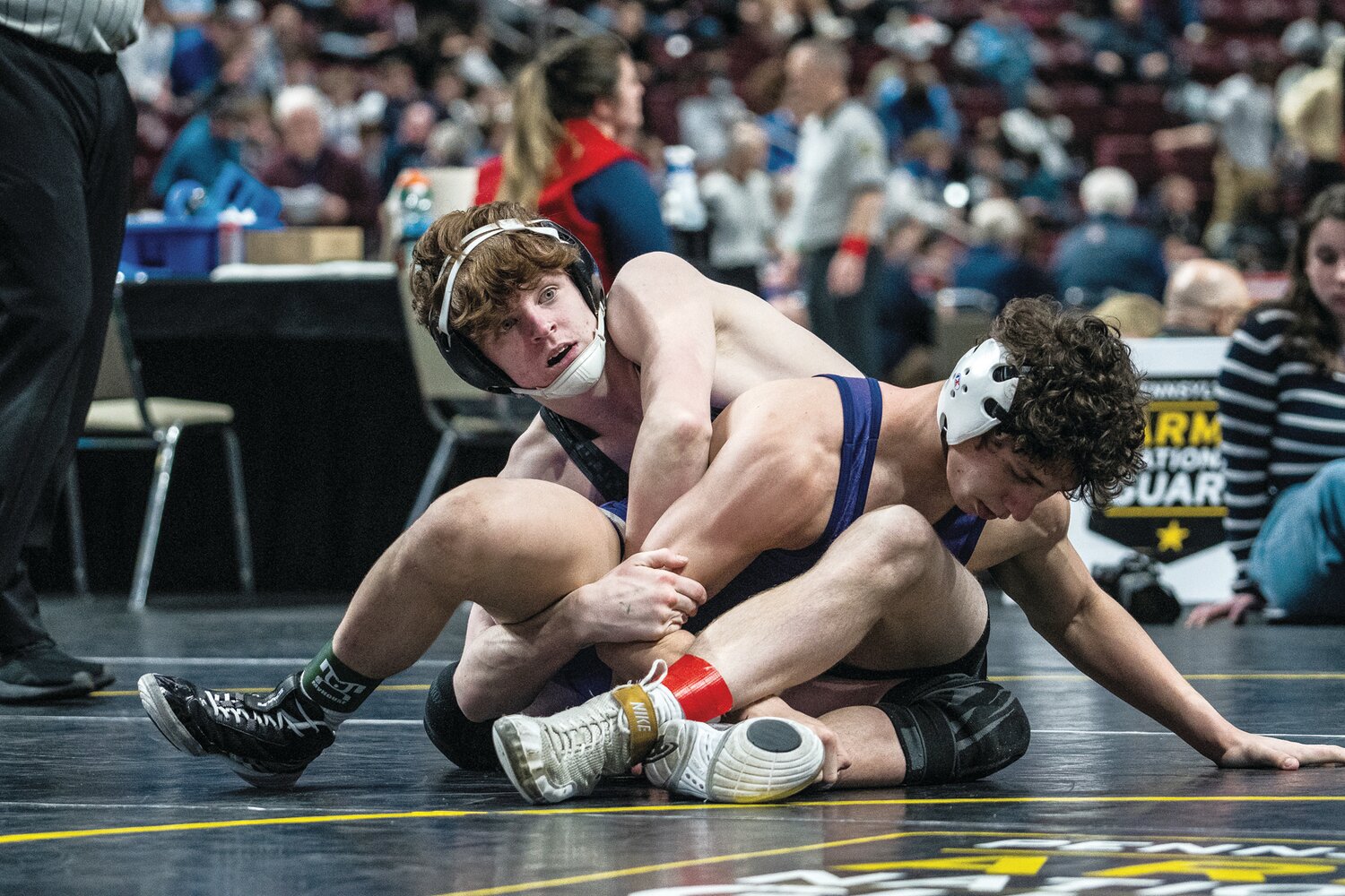 Central Bucks West’s Patrick Kelly wrestles in the 139-pound class at the PIAA 3A championships. Kelly went on to claim fourth place.