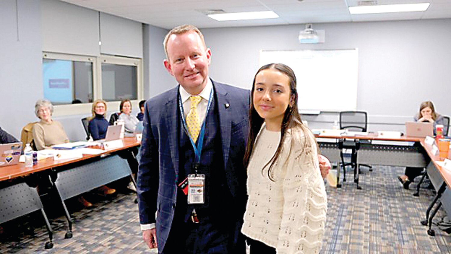 New Hope-Solebury Superintendent Dr. Charles Lentz congratulates student Jill Leyman for earning a $2,000 scholarship from the MassMutual Foundation.