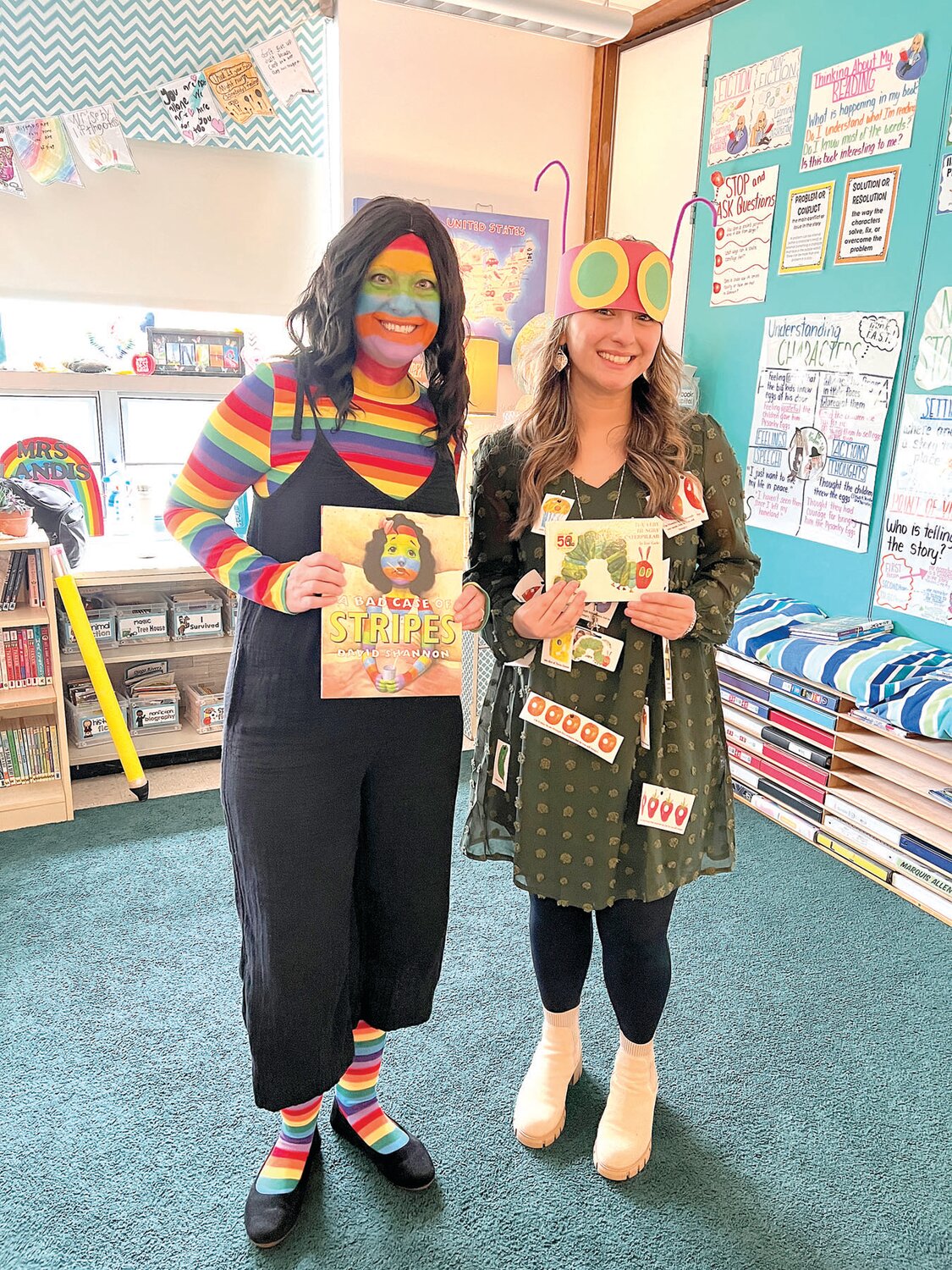 Grasse Elementary School teachers Heather Landis, left, and Sabrina Sieverts dress as the characters in “A Bad Case of Stripes” and “The Very Hungry Caterpillar.”