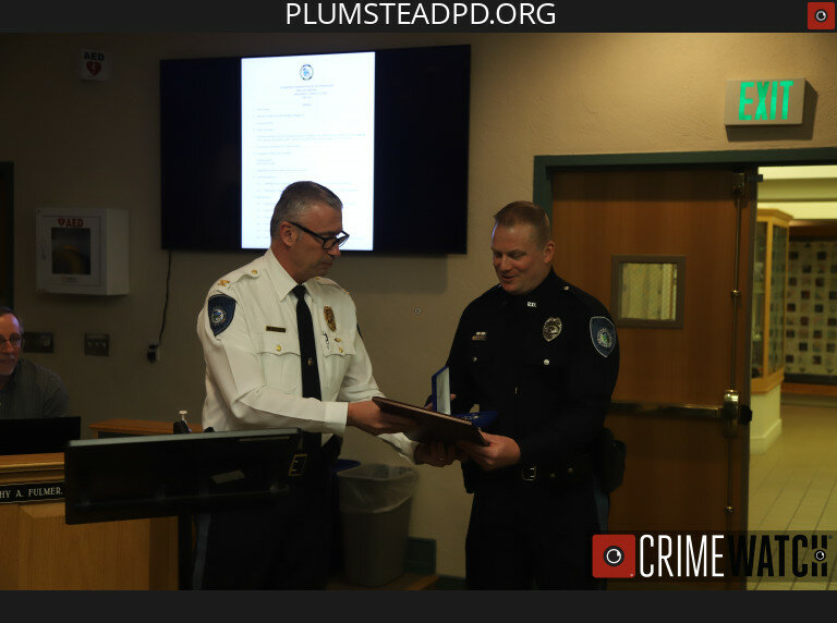 Plumstead Township Police Department Officer Thomas J. Rutecki  receives an award from Chief David Mettin.