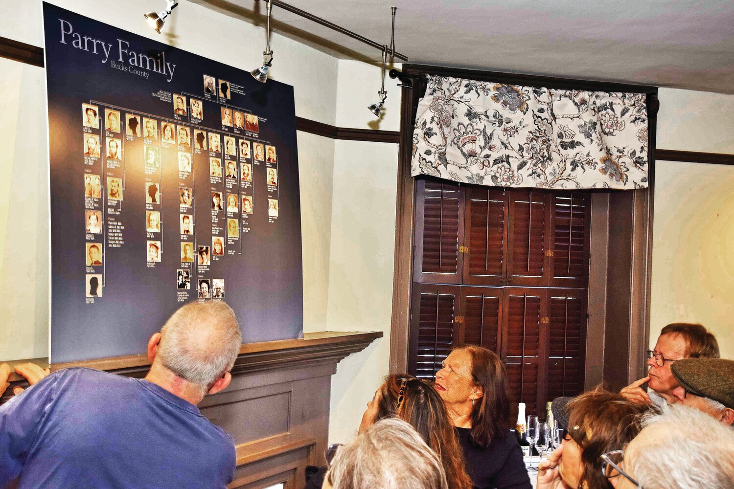 Visitors look at the Parry family tree.
