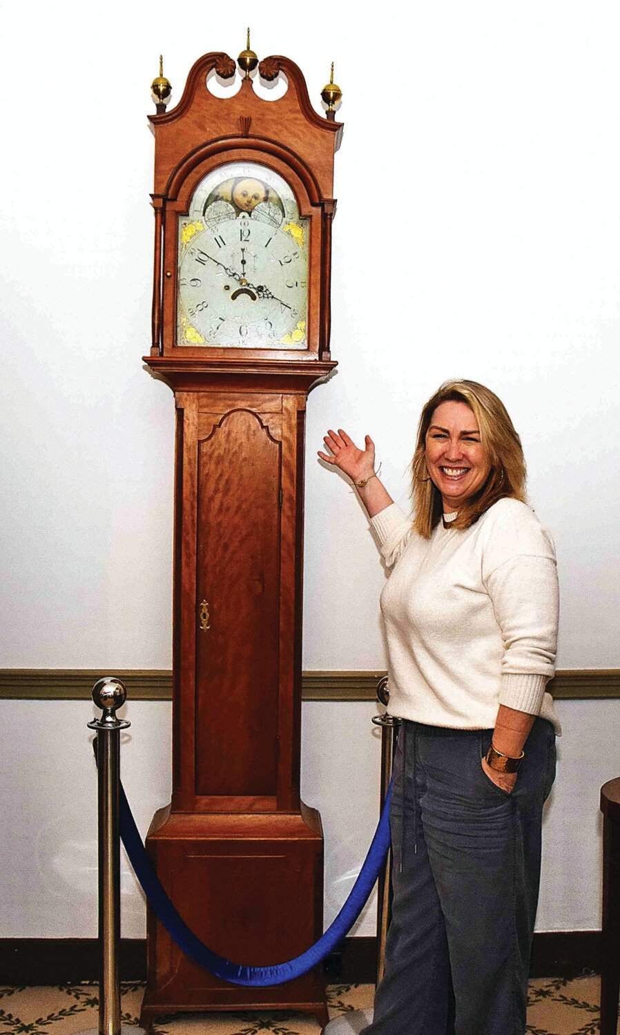 Kirsten Bronkovic, executive director of the New Hope Historical Society and the Parry Mansion Museum, with the restored 200-year-old Parry grandfather clock.