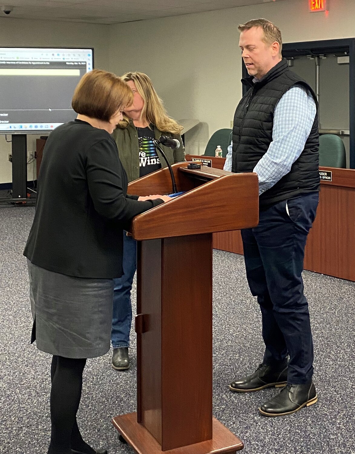 Rob Dugger is sworn in by Central Bucks Assistant to the Superintendent Stephanie Radcliffe Monday after being appointed the school board.