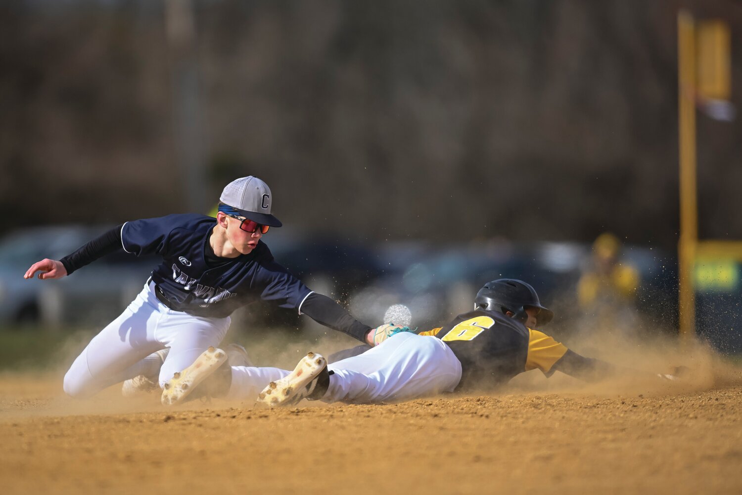 New Hope-Solebury’s Kieran Patel slides into second base ahead the tag of Calvary Christian shortstop Michael Prate during the first inning.