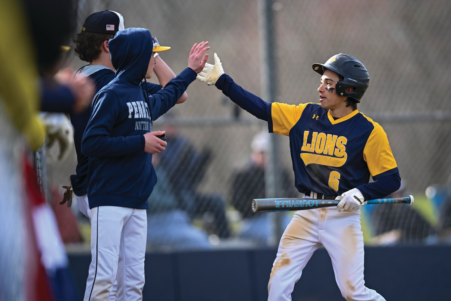 New Hope-Solebury’s Kieran Patel gets greeted by the team after scoring the game’s first run in the first inning.