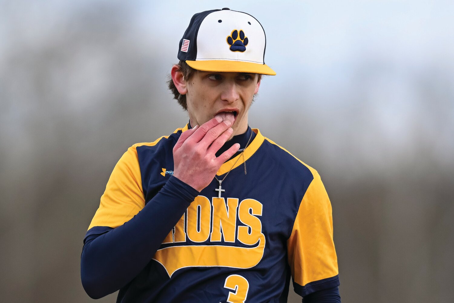 New Hope-Solebury pitcher Tyler Corino tries to get the feeling back in his hand on a chilly day for baseball.