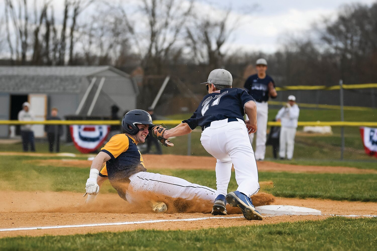 New Hope-Solebury’s Joel Carmenini beats the tag attempt of Calvary Christian’s Brian Weed in the Lions’ six-run second inning.