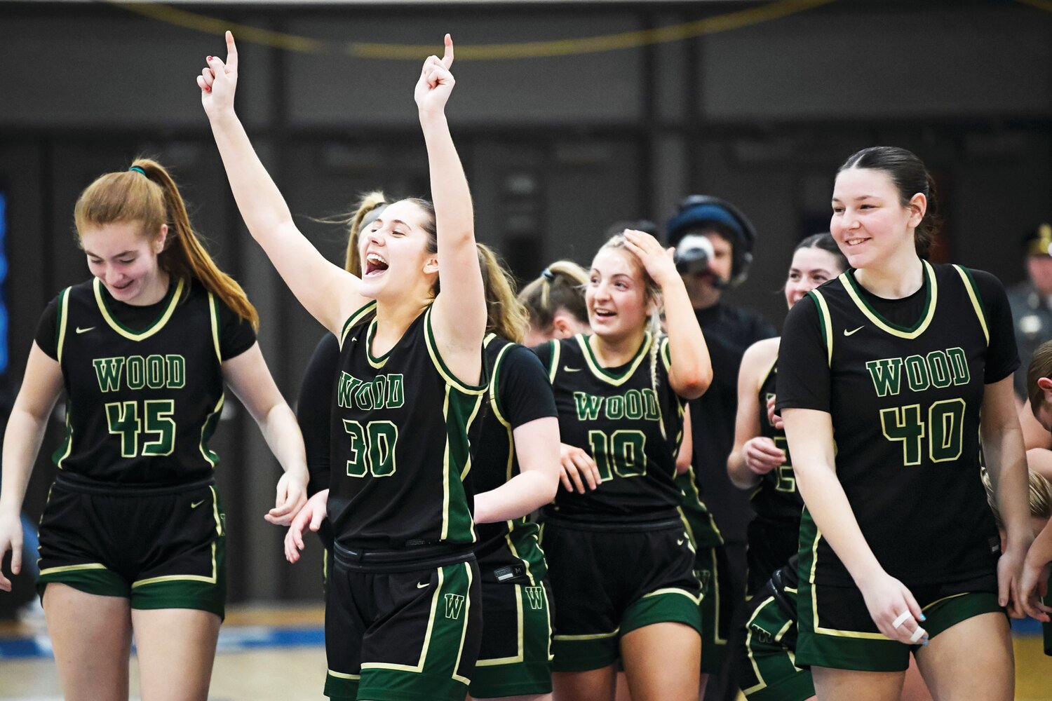 Archbishop Wood’s Emily Knouse celebrates with the fans after the final buzzer in Wood’s PIAA semifinal victory over Bethlehem Catholic Tuesday.