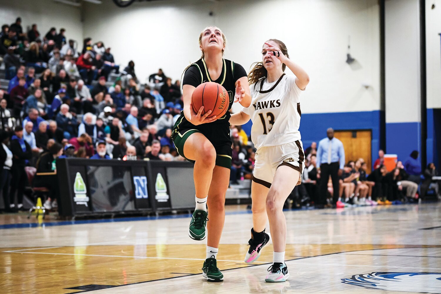 Archbishop Wood’s Sophia Topakas drives past Bethlehem Catholic’s Kendall Nickischer in the fourth quarter for an easy two points.
