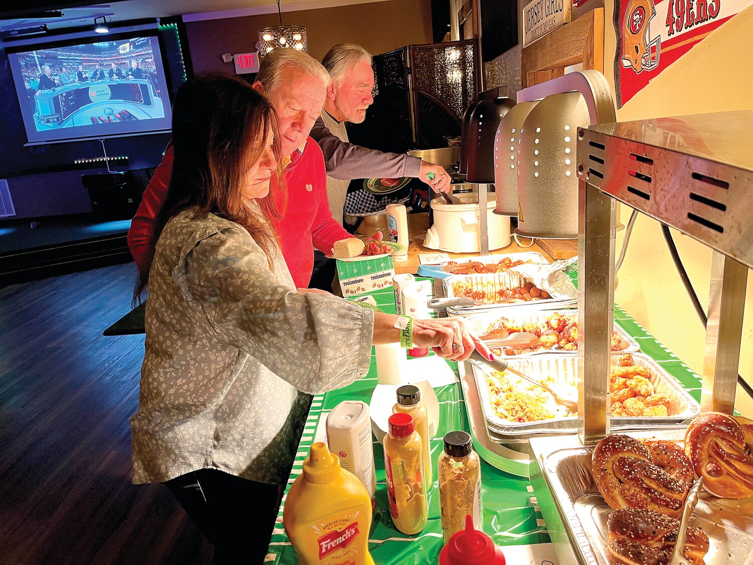 Members enjoy the buffet during the Lambertville Elks Lodge 1070 event on Super Bowl Sunday.