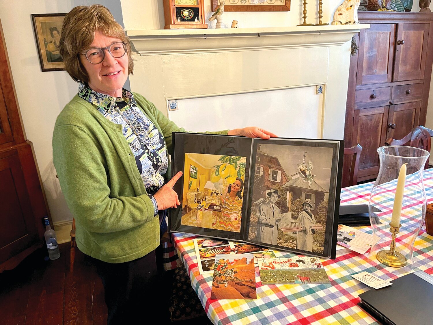 Kathy Brown displays one of many books she has of her decoupage artwork.