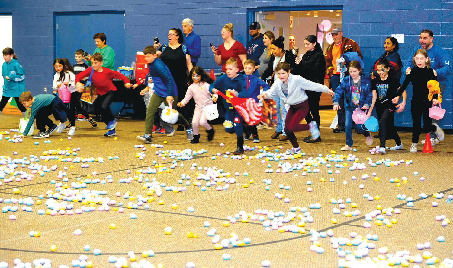 Kids race to get their hands on the eggs.
