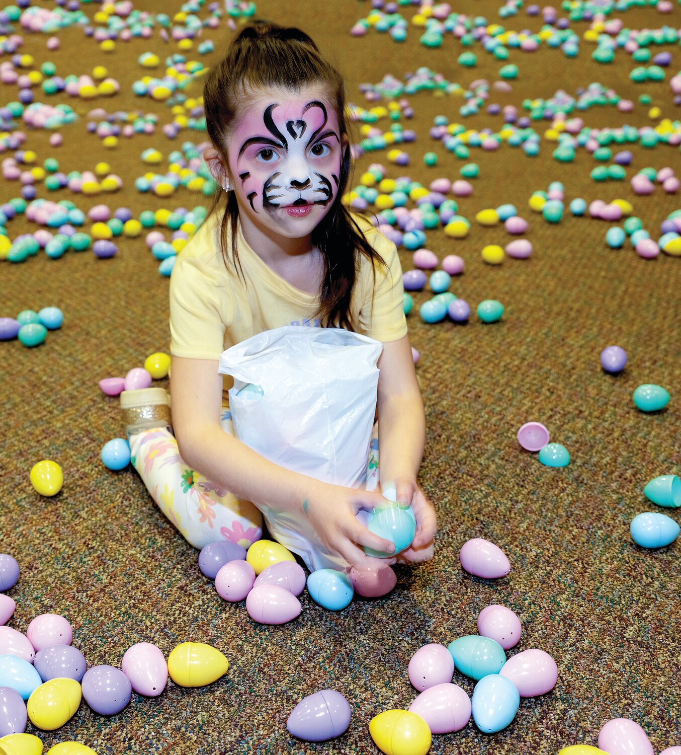 Nora Kutys collects eggs.