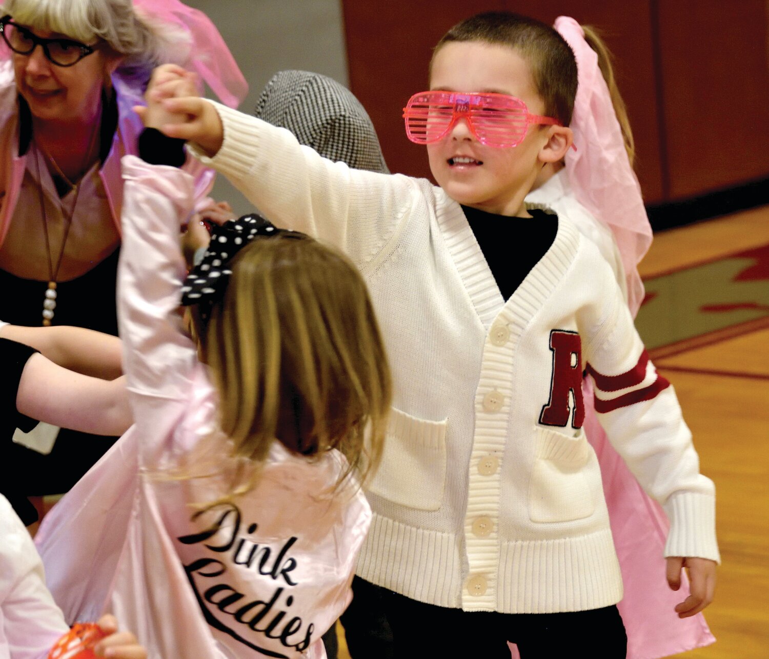 Grady Williams, 5, spins Kaia Bontempo, 4, at the dance.